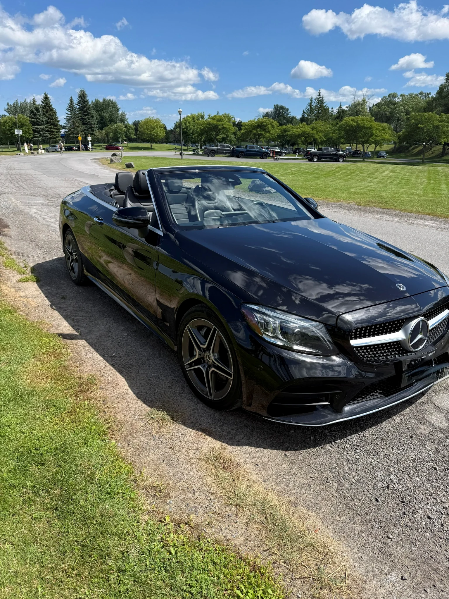 Black 2019 Mercedes-Benz C 300 Cabriolet beside the waterfront
